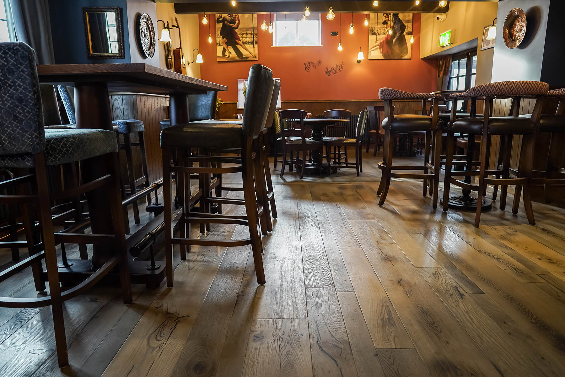 Mixed-width oak planks in a traditional pub setting.