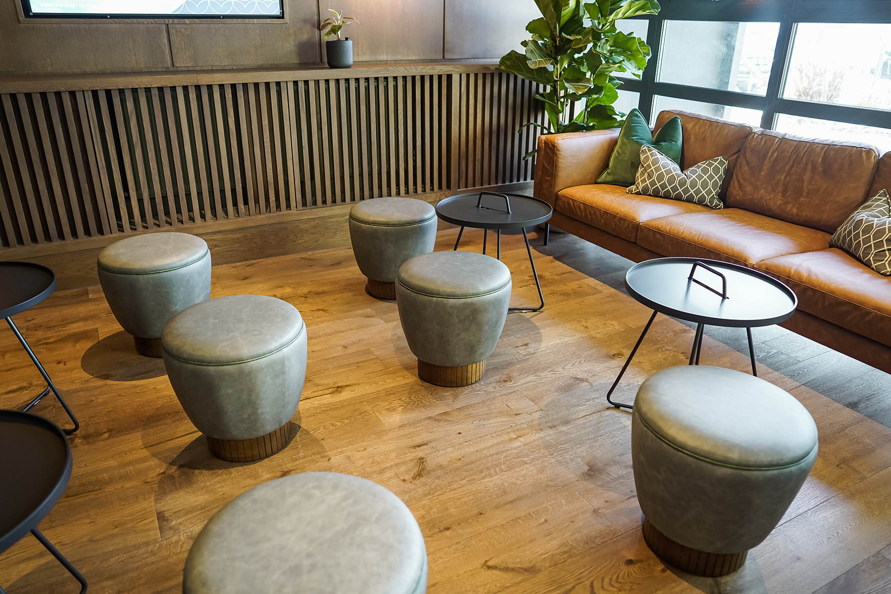 Stylish seating area with wood flooring and decorative elements.