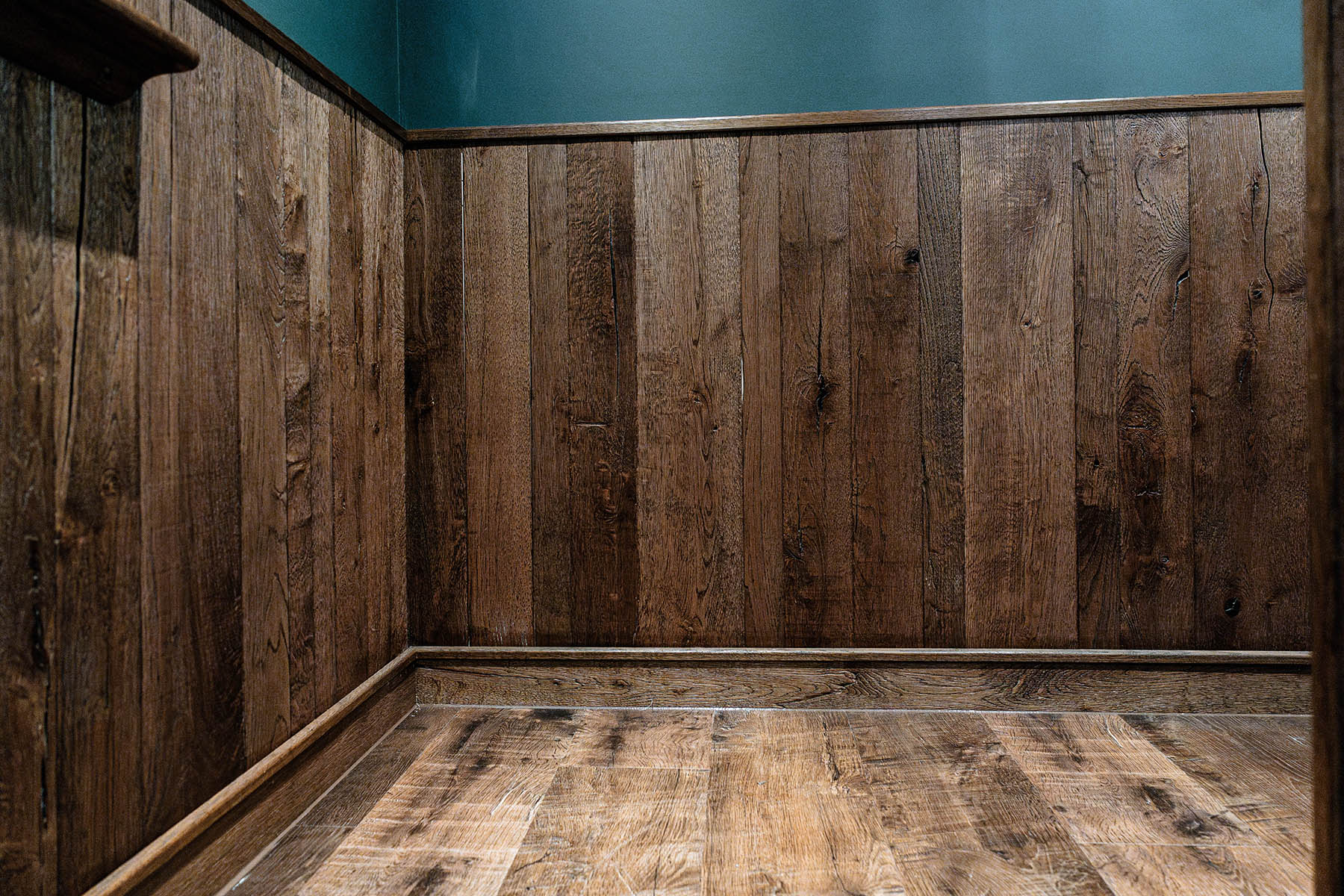 Bespoke oak wall cladding in premium steakhouse interior