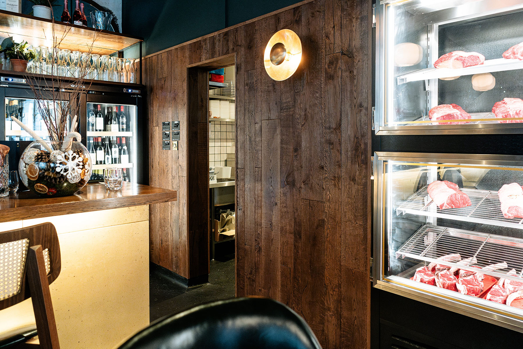 Refined restaurant interior featuring bespoke wall cladding