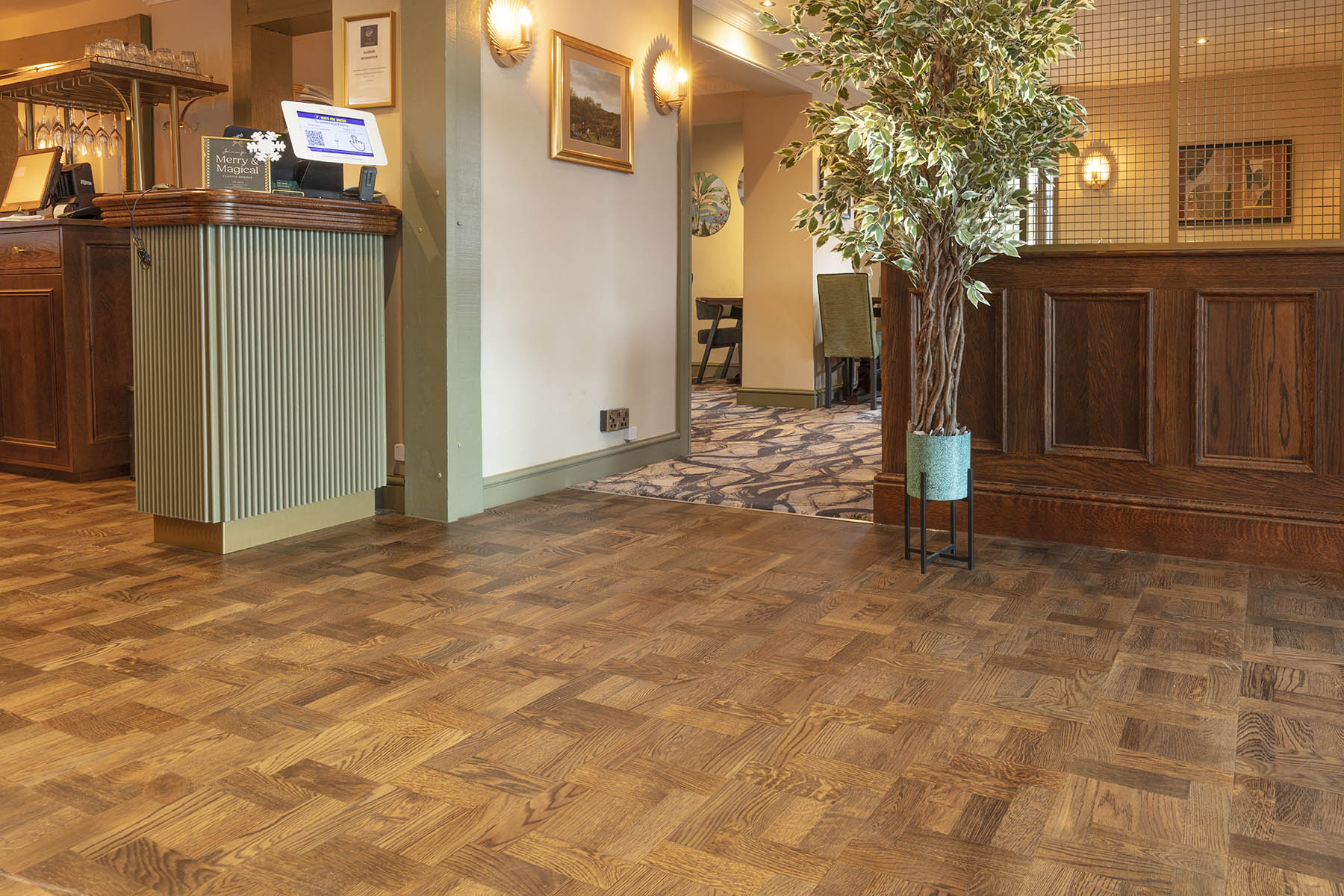 Foxtrot Park basketweave flooring installed in The Swan Country Pub, highlighting rustic charm and elegant interiors.