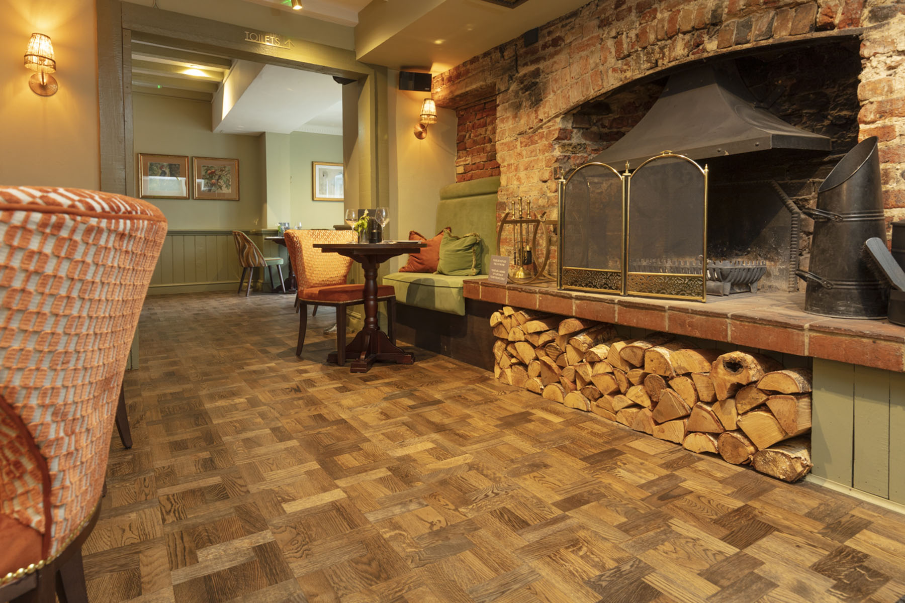 Close-up of JackEvie’s Foxtrot Park basketweave wood flooring, featuring warm tones and intricate geometric patterns.