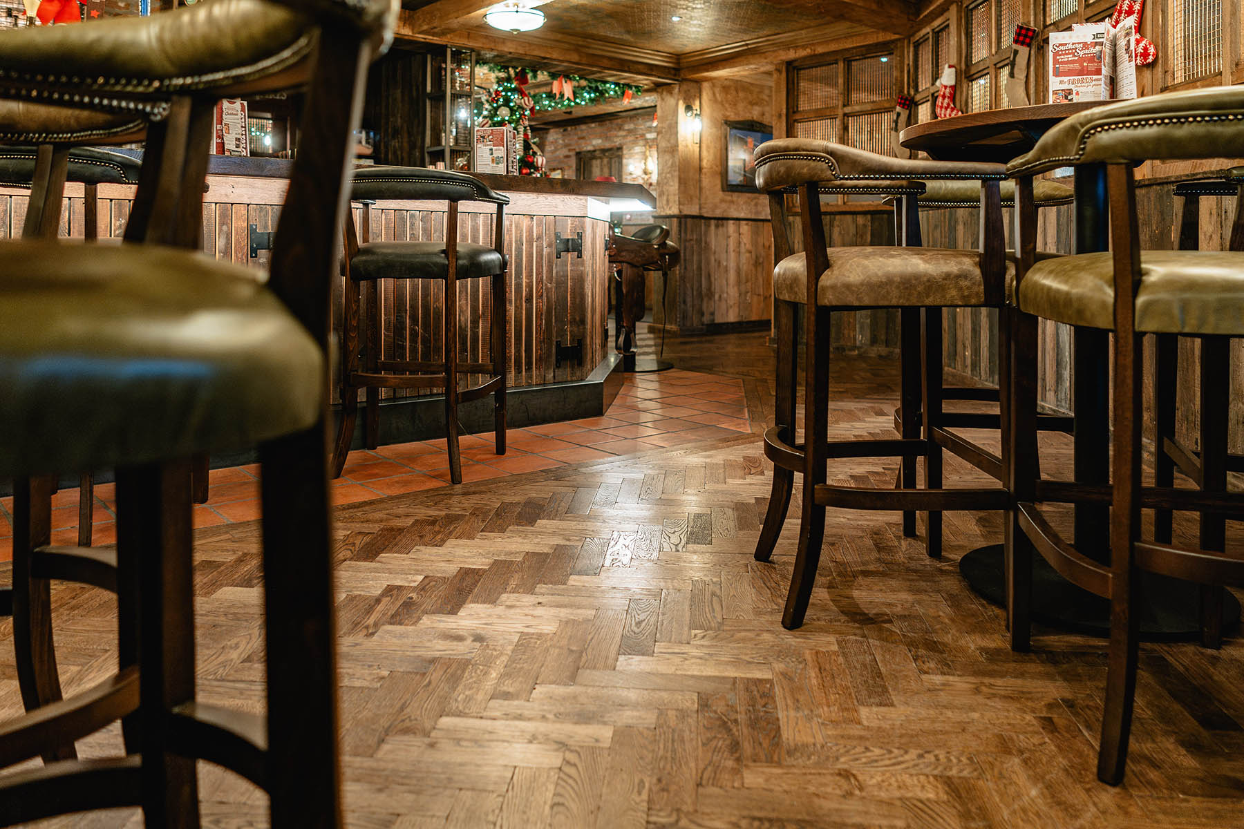 Bespoke herringbone flooring in Hickory’s Smokehouse bar area.
