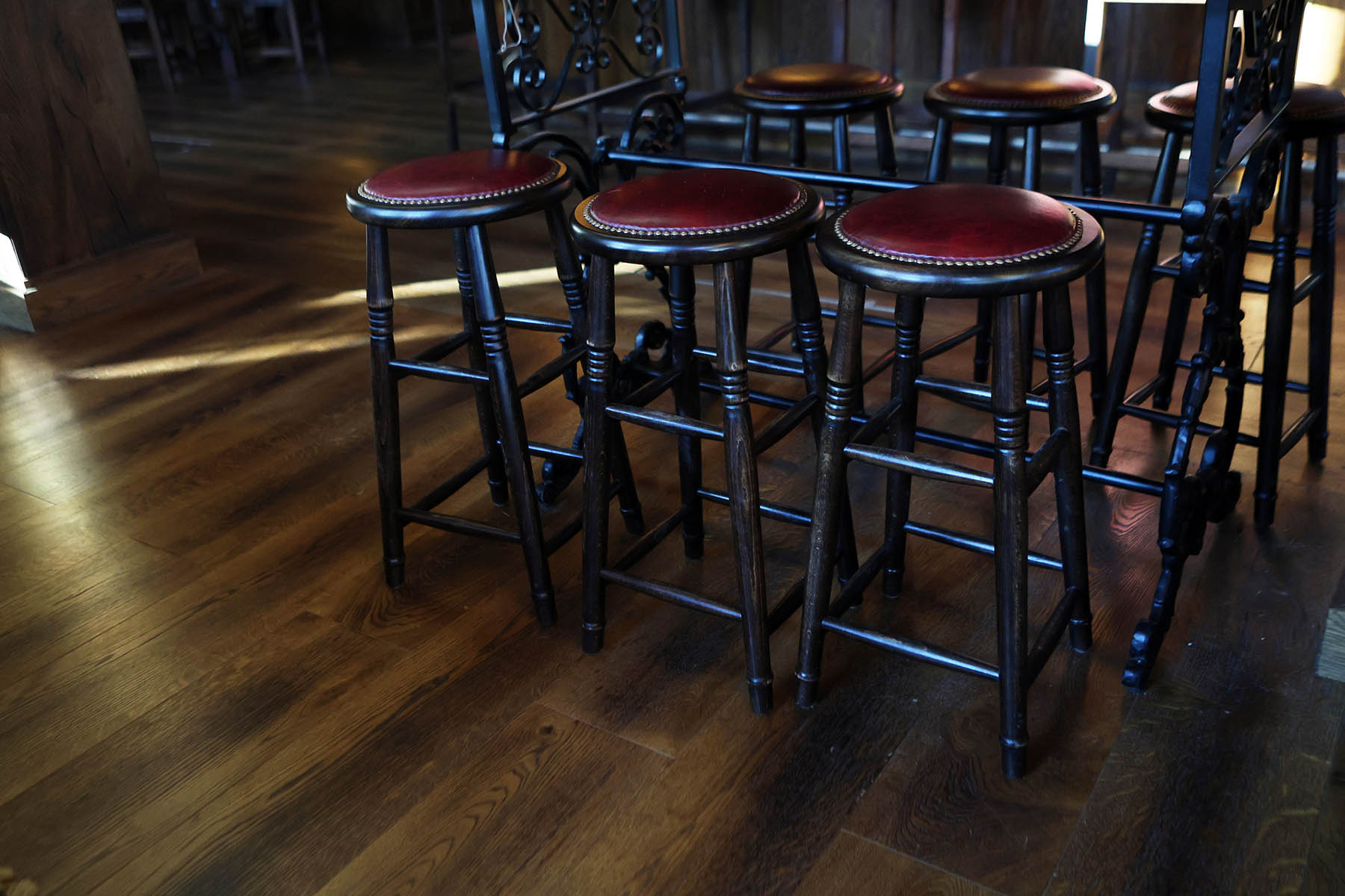 Wide plank wooden flooring in a stylish hospitality setting.