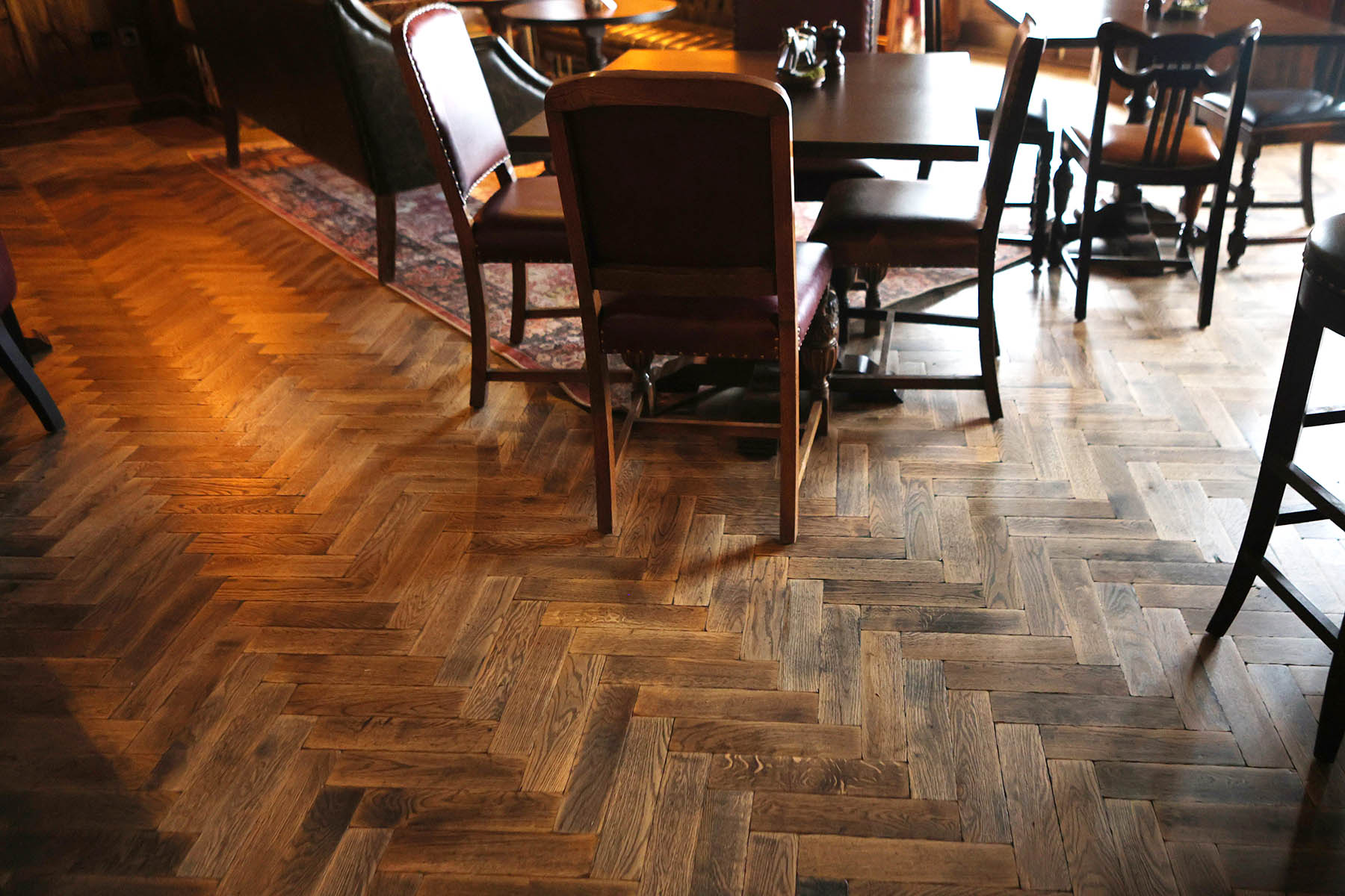 Richly textured oak parquet flooring with a UV oil finish.