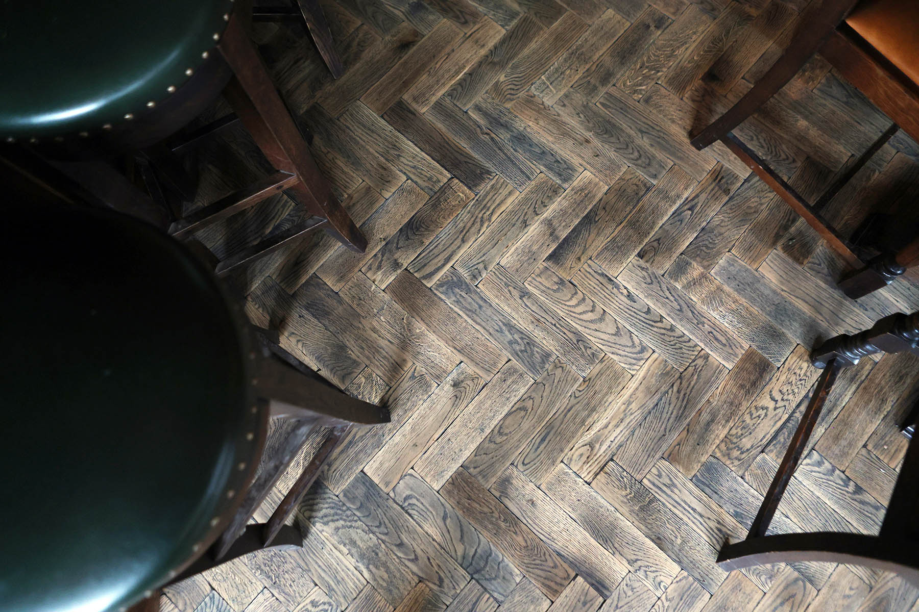 Classic herringbone pattern enhancing pub interior design.