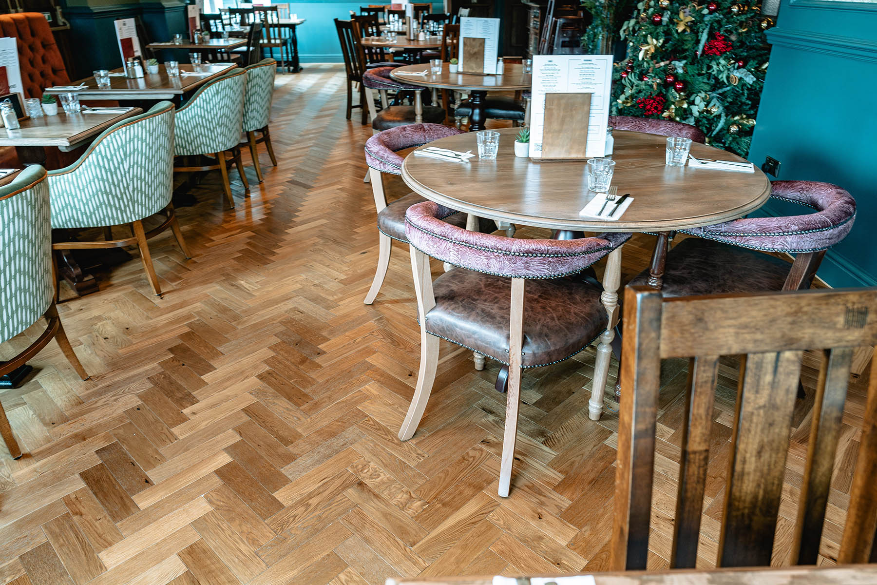 Bulwell Close herringbone flooring defining seating areas in The Bellflower.
