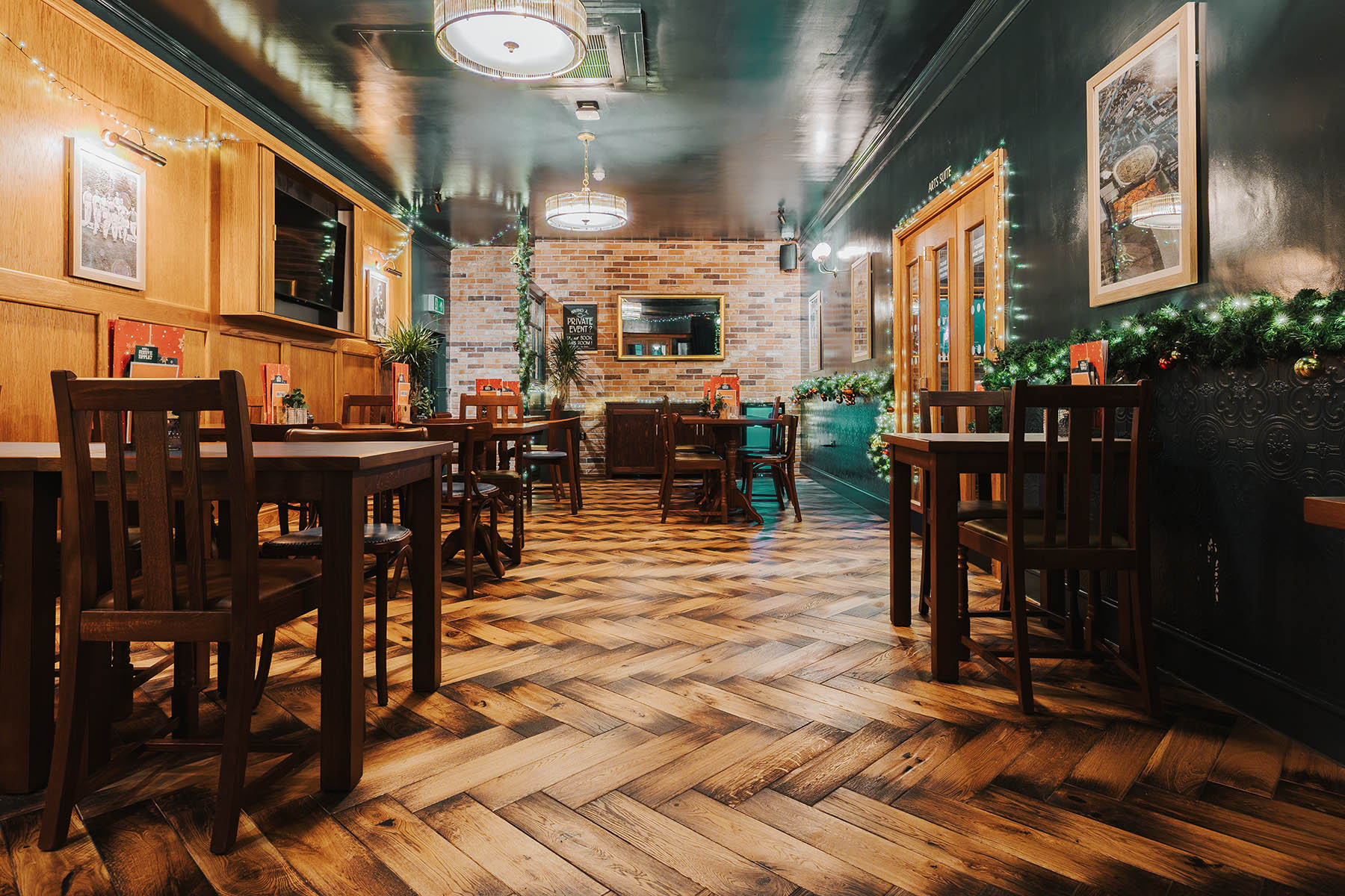 Intricate parquet flooring detail in a Grade II-listed pub interior.
