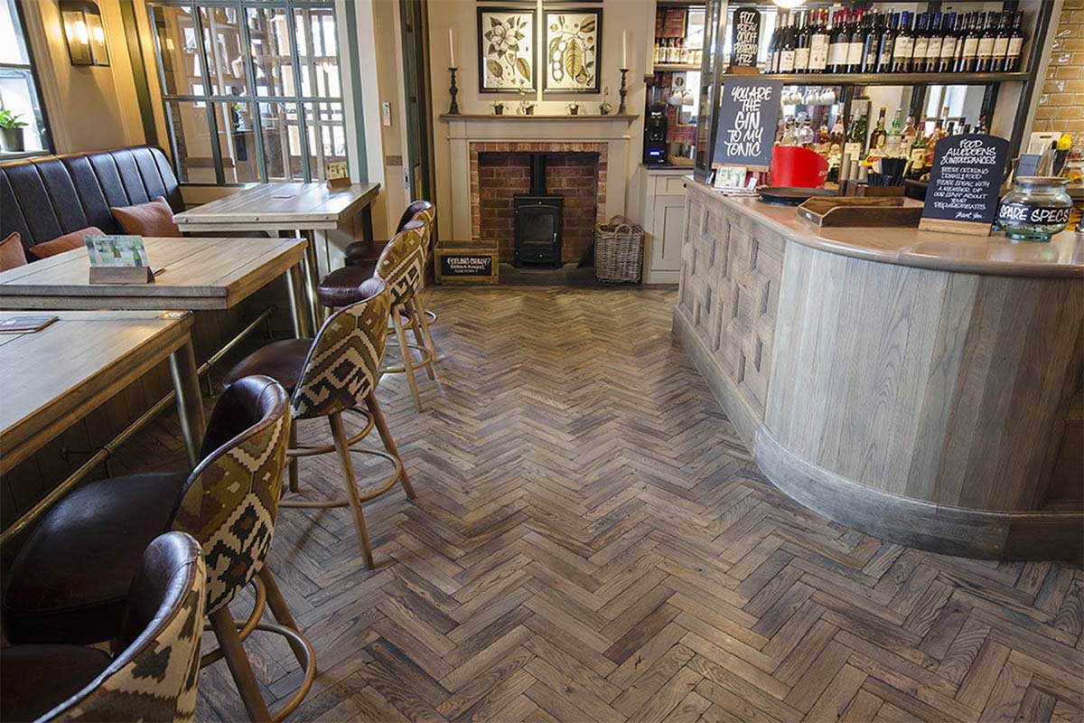 Solid oak herringbone wood flooring in a pub.